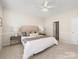 Bright bedroom with neutral decor includes ceiling fan and en-suite bathroom at 3465 Caldwell Ridge Pkwy, Charlotte, NC 28213