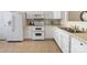 Bright kitchen featuring white cabinets, modern appliances, and ceramic tile flooring at 3465 Caldwell Ridge Pkwy, Charlotte, NC 28213