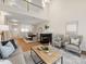 Spacious living room features fireplace, access to dining room, and lots of natural light at 3465 Caldwell Ridge Pkwy, Charlotte, NC 28213