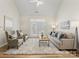 Spacious living room features a fireplace, high ceilings, and natural light at 3465 Caldwell Ridge Pkwy, Charlotte, NC 28213