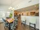 Cozy dining area with hardwood floors, chandelier, and an open view to the living spaces at 3628 Benseval Ln, Matthews, NC 28104
