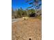 A landscape view of the grounds with a newly graveled drive at 37254 Barnhardt Rd, New London, NC 28127