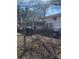 Exterior photo shows a partially enclosed back porch of a home surrounded by a chain link fence at 37254 Barnhardt Rd, New London, NC 28127