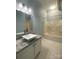 Bathroom featuring a granite countertop vanity and a shower-tub combination at 404 N Laurel Ave # 28, Charlotte, NC 28204