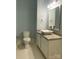 Bathroom featuring a vessel sink on a granite countertop with a toilet and a tiled floor at 404 N Laurel Ave # 28, Charlotte, NC 28204
