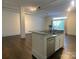 Kitchen island with granite counters, stainless steel appliances, and hardwood floors at 404 N Laurel Ave # 28, Charlotte, NC 28204