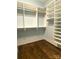 Bright walk-in closet with adjustable shelving, providing ample storage space for clothing and accessories at 404 N Laurel Ave # 28, Charlotte, NC 28204