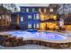 Backyard view of a home with a large swimming pool, spa, patio, and lush landscaping at 4893 River Hills Dr, Denver, NC 28037
