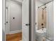 Bathroom with a shower-tub combo and classic white fixtures at 4893 River Hills Dr, Denver, NC 28037