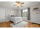Cozy bedroom with natural lighting, hardwood floors, and stylish decor at 4893 River Hills Dr, Denver, NC 28037