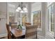 Breakfast nook with large windows offering a view of the lush surroundings at 4893 River Hills Dr, Denver, NC 28037