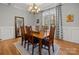 Bright dining room with a chandelier and view of trees through a window at 4893 River Hills Dr, Denver, NC 28037