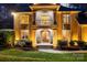 Stunning home exterior featuring a stone facade, elegant entryway with double doors, and manicured landscaping at 4893 River Hills Dr, Denver, NC 28037