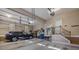 Spacious garage with storage, staircase, and a black SUV parked inside at 4893 River Hills Dr, Denver, NC 28037