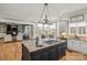 Open concept kitchen with a granite island, modern appliances, and ample counter space at 4893 River Hills Dr, Denver, NC 28037