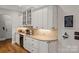 Kitchen featuring display cabinets, granite countertops, and a wine cooler at 4893 River Hills Dr, Denver, NC 28037