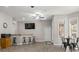 Open-concept living area with bar seating, dining space, and natural light at 4893 River Hills Dr, Denver, NC 28037