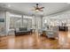 Spacious living room boasts gleaming hardwood floors, ample natural light, and neutral decor at 4893 River Hills Dr, Denver, NC 28037