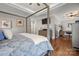 Angle view of the bedroom that showcases the ensuite office space and hardwood floors at 4893 River Hills Dr, Denver, NC 28037