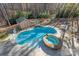 Aerial view of a backyard pool with a hot tub, shed, and mature trees at 4893 River Hills Dr, Denver, NC 28037