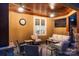 Inviting covered porch with comfortable seating, ceiling fans, and ambient lighting at 4893 River Hills Dr, Denver, NC 28037