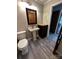 Updated bathroom featuring a pedestal sink, new fixtures, and modern flooring at 501 Catawba N Cir, Matthews, NC 28104