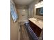 Cozy bathroom with a tub, shower, wooden cabinets, and neutral walls at 501 Catawba N Cir, Matthews, NC 28104