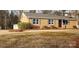 Inviting brick home featuring tidy landscaping and blue shutters at 501 Catawba N Cir, Matthews, NC 28104