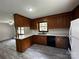 Well-lit kitchen featuring ample countertop space and updated flooring at 501 Catawba N Cir, Matthews, NC 28104