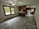 Open-concept kitchen and dining area featuring wood cabinets and new flooring at 501 Catawba N Cir, Matthews, NC 28104