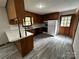 Efficient kitchen with ample cabinet space and updated flooring at 501 Catawba N Cir, Matthews, NC 28104