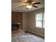 Cozy living room features a brick fireplace, wood-look flooring, and bright natural light at 501 Catawba N Cir, Matthews, NC 28104