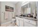Bathroom with granite countertops, vanity with sink and decorative mirror at 505 2Nd Street Ne Pl # G-3, Conover, NC 28613