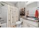 Bathroom featuring a shower and tub combination, sink, and decorative tropical-themed curtain at 505 2Nd Street Ne Pl # G-3, Conover, NC 28613