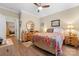 Bedroom with a large bed, hardwood floors, and easy access to another room at 505 2Nd Street Ne Pl # G-3, Conover, NC 28613