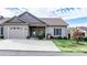 Charming home exterior featuring a well-kept lawn, garage, and welcoming entrance at 505 2Nd Street Ne Pl # G-3, Conover, NC 28613