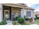 Cozy front porch features stone accents, welcoming decor, and comfortable seating, creating an inviting entrance at 505 2Nd Street Ne Pl # G-3, Conover, NC 28613