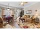 Cozy living room with hardwood floors, comfortable sofa, festive decor, and adjacent dining area at 505 2Nd Street Ne Pl # G-3, Conover, NC 28613