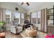 Bright living room with hardwood floors, large windows, and a ceiling fan at 505 2Nd Street Ne Pl # G-3, Conover, NC 28613