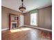 Bedroom boasting natural light, decorative fireplace and mantle, and detailed crown moulding at 505 Camden Rd, Wadesboro, NC 28170