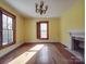 Bedroom with hardwood floors and natural light from windows with traditional wood shutters at 505 Camden Rd, Wadesboro, NC 28170