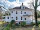 Spacious two-story home with a covered deck, classic details, and a lush yard at 505 Camden Rd, Wadesboro, NC 28170