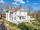 Elegant two-story home featuring a porch, white columns, and inviting outdoor spaces at 505 Camden Rd, Wadesboro, NC 28170
