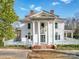 Majestic two-story home with tall white columns, covered porch, and classic architectural details at 505 Camden Rd, Wadesboro, NC 28170