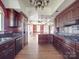 Gourmet kitchen featuring dark wood cabinets, granite counters, and an open layout with a large island at 505 Camden Rd, Wadesboro, NC 28170
