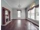 Spacious living room featuring hardwood floors, a fireplace, and plenty of natural light at 505 Camden Rd, Wadesboro, NC 28170