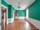 Inviting living room featuring wood floors, tall ceilings and a view of the outside at 505 Camden Rd, Wadesboro, NC 28170