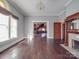 Bright and airy living room with hardwood floors, fireplace, and classic architectural details at 505 Camden Rd, Wadesboro, NC 28170