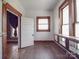 Cozy living room featuring hardwood floors, window casings, and storage cabinet at 505 Camden Rd, Wadesboro, NC 28170