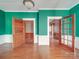 Inviting living room featuring wood floors, tall ceilings and french doors to another living space at 505 Camden Rd, Wadesboro, NC 28170